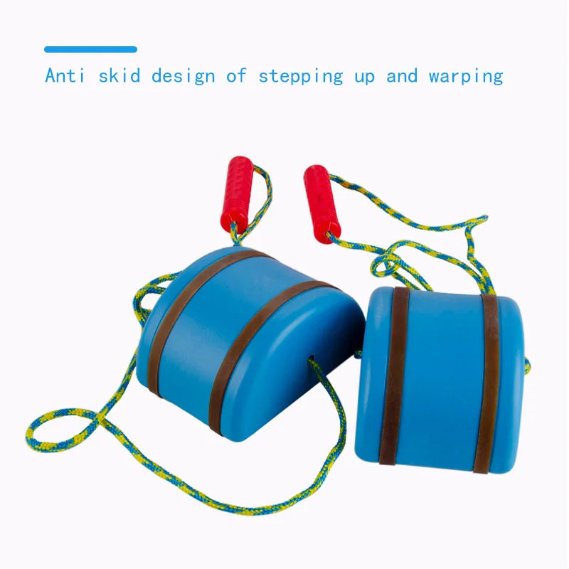 The Interactive Outdoor Balance Board Seesaw for Kids, designed in bright blue plastic with brown anti-skid stripes and yellow-green ropes attached to red handles, is shown on a white background. The text reads: Anti skid design of stepping up and warping, highlighting this fun sensory training toy.