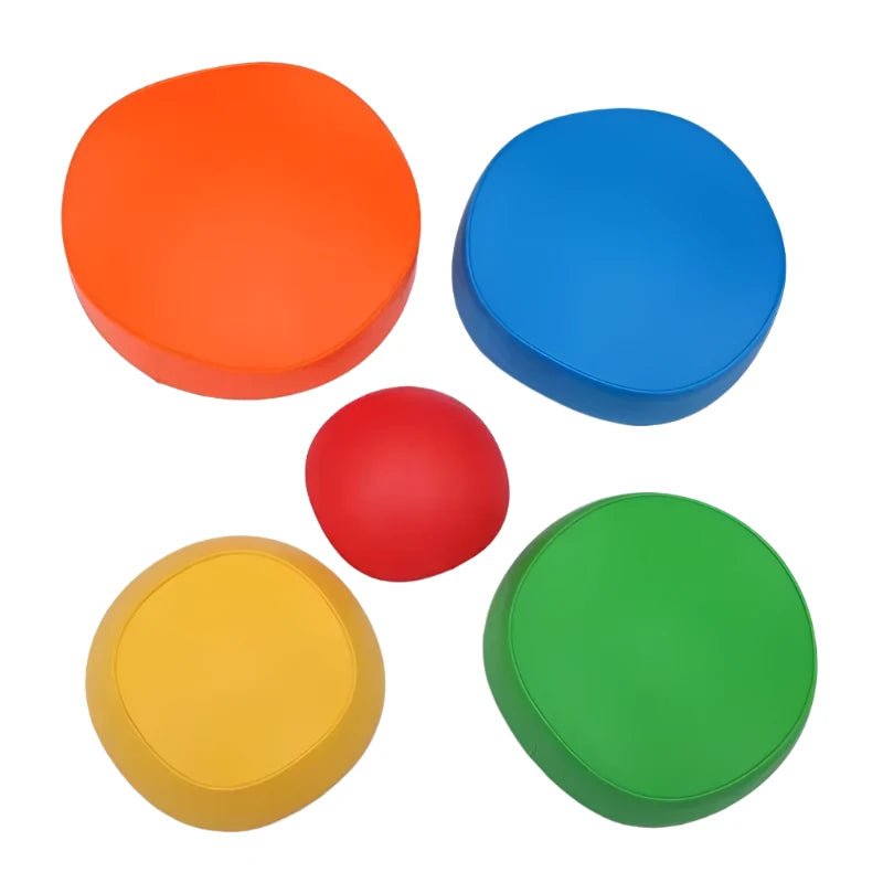 Five vibrant Adventure Balance Stones in orange, blue, yellow, green, and red lie scattered on a white background. Ideal for sensory balance activities that enhance motor skills.