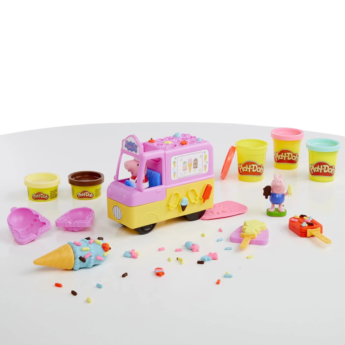 The Play-Doh Peppas Ice Cream Playset includes a toy ice cream truck on a white surface with molds and accessories for crafting ice cream shapes using vibrant Play-Doh. It features cartoon animal models and anime figures, perfect as a collectible girl toy for children.