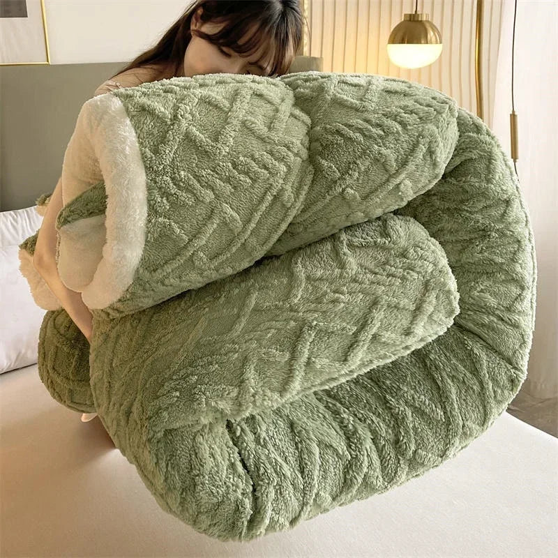 A person carries the Luxurious Artificial Cashmere Weighted Blanket, a large green plush comforter with soft white lining, in a modern room featuring a green headboard and warm-toned ceiling lamp.
