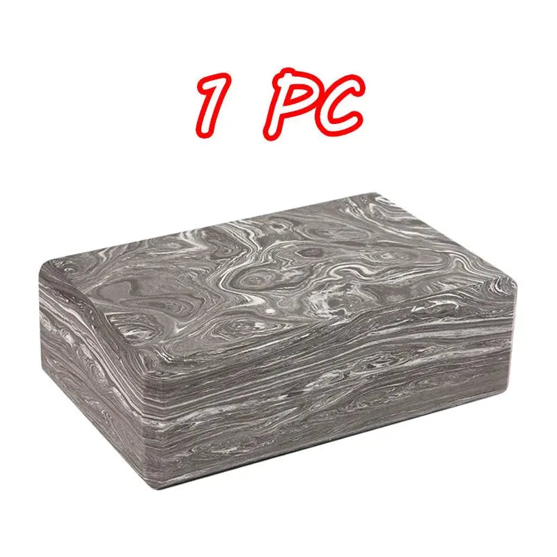 A gray marbled block, similar to Montessori Sensory Balance Stones for Outdoor Play and Integration Activities, features bold red 1 PC text in a playful font. It has a smooth texture with swirling white designs.