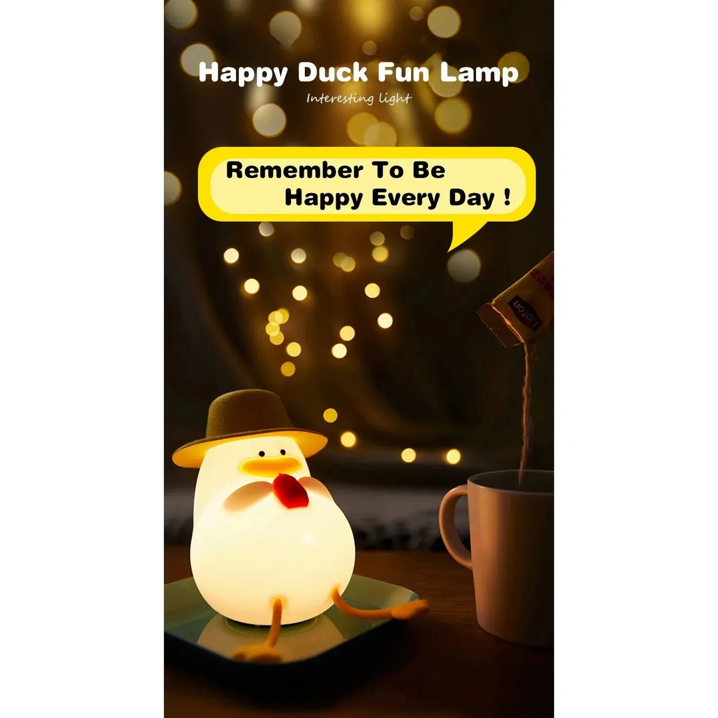 The Cute Cartoon Duck Rechargeable LED Night Light, a silicone bedside lamp ideal for kids room decor and a perfect birthday gift, wears a hat and emits a cozy glow. It sits near a mug with the warm light illuminating the phrase Remember To Be Happy Every Day! creating serenity.