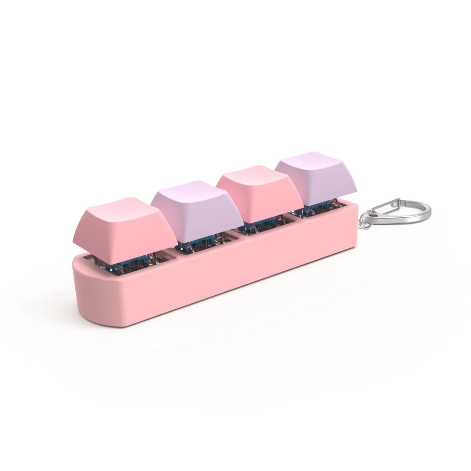 The 4Keys Finger Button Anti Stress Keychain features four mechanical keyboard keycaps in pink and purple on a rectangular base with a metal keyring—a cute decompression toy and calming gift for kids and adults.