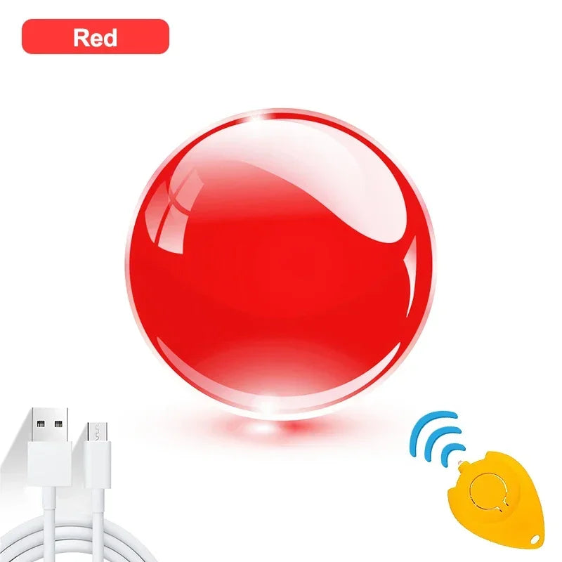 A red Magic Flying Ball Mini Toy Boomerang Spinner is centered on a white background, with a USB charging cable and yellow remote control nearby. A red label at the top shows the color.