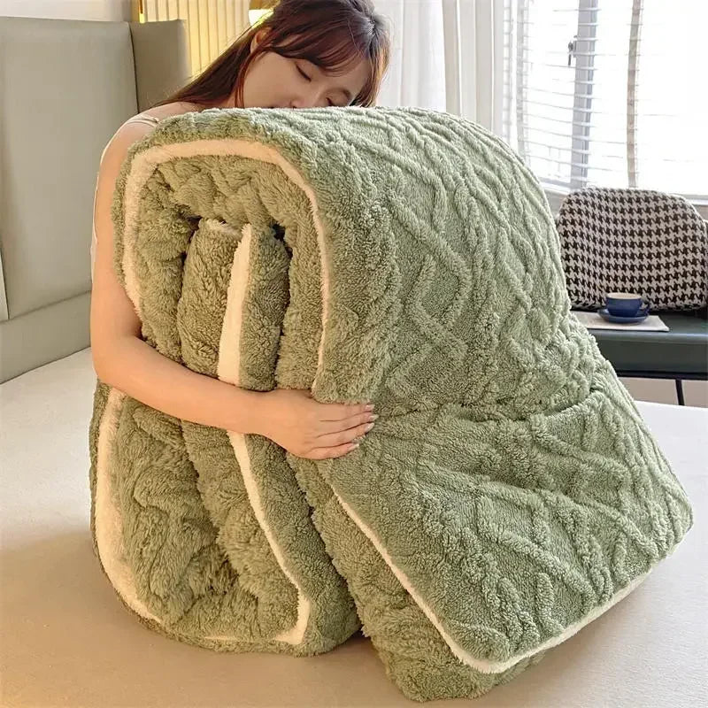 A woman cuddles a Luxurious Artificial Cashmere Weighted Blanket, fluffy and green with a white interior, on her bed in a well-lit room featuring a window and patterned pillow.