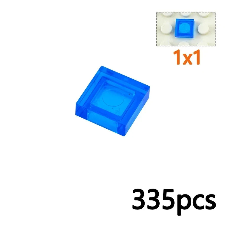 A close-up shows a 3070-Clear Blue 1x1 tile from the MOC Transparent Bulk Brick Set, plus an inset of it on a white baseplate. Ideal for custom creations and LEGO-compatible builds. Text reads: 335pcs.