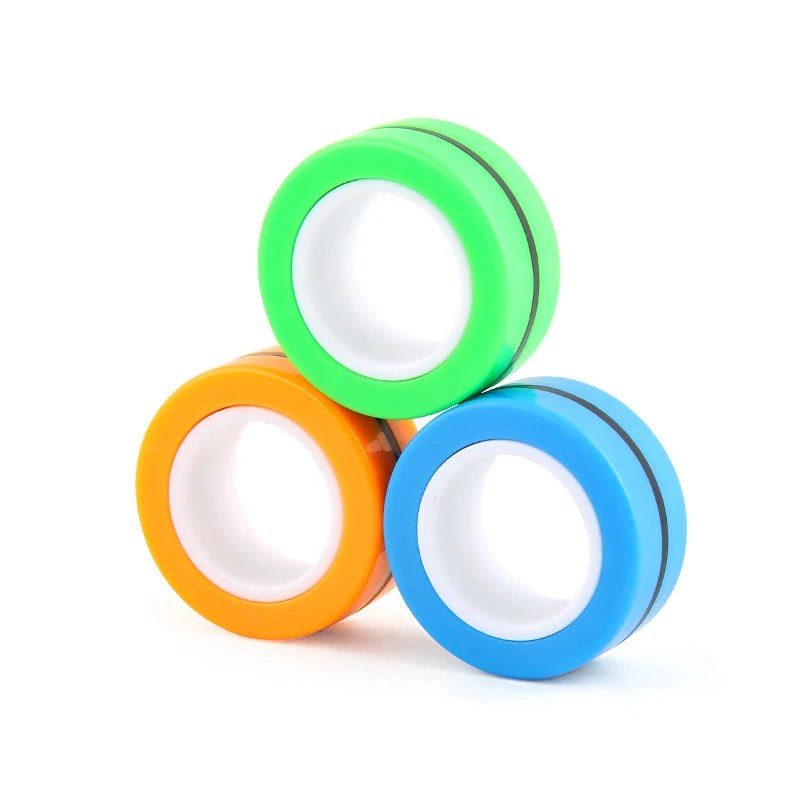 The 3PCS Finger Magnetic Rings Fidget Toys for Anxiety, ADHD, and Stress Relief include green, orange, and blue plastic rings with white inner circles and black stripes, stacked in a pyramid on a white background.