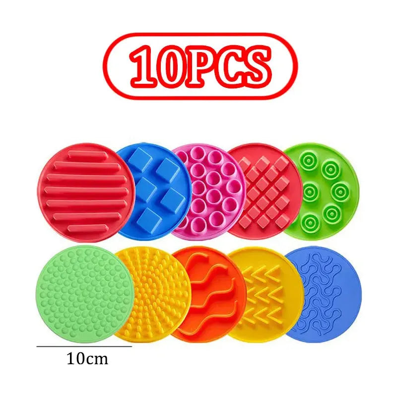 Ten colorful Montessori Sensory Foot Toys for Kids are arranged in two rows, showcasing textures like stripes, dots, and waves. Each 10 cm pad is perfect for sensory integration and balance training. 10PCS is prominently displayed at the top.