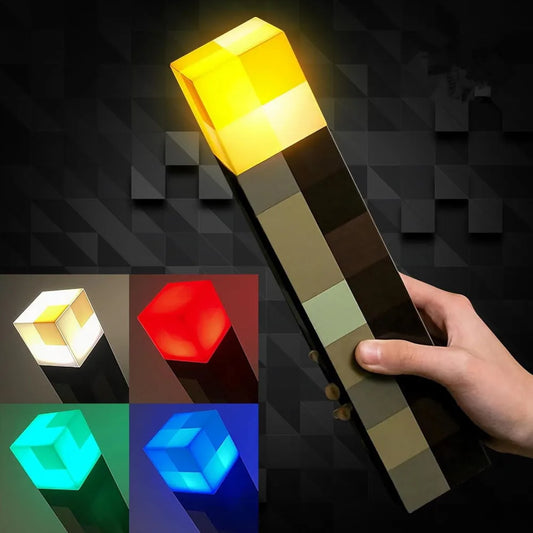 A hand holds the MC Game Brownstone Torch Lamp Figure, a USB rechargeable night light for bedrooms. Four images below show its LED glowing in white, red, green, and blue. The dark, blocky background highlights its Minecraft-inspired design.