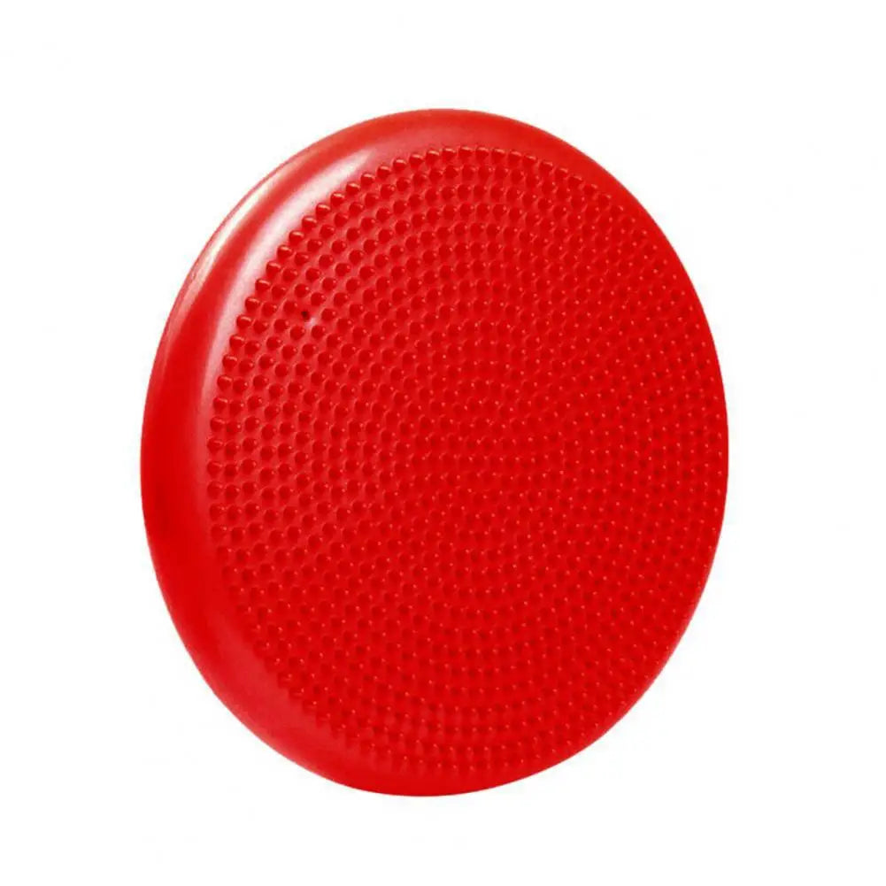 The non-slip balance training mat set with an air cushion disc features a round, textured red surface for stability exercises and core strength development. Ideal for yoga enthusiasts seeking improved balance and stability.