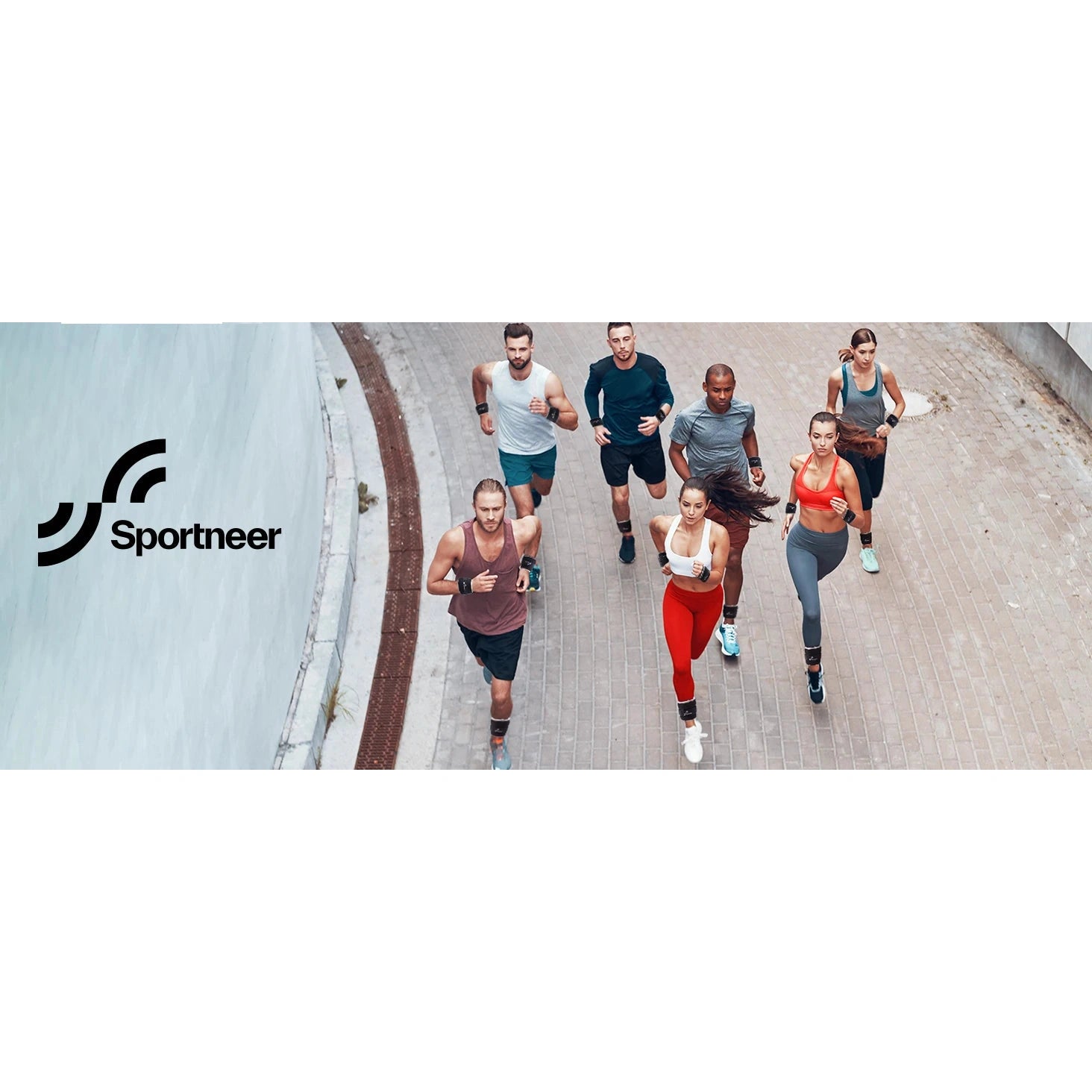 Seven people jog on a paved path by a wall, with the Sportneer logo visible left. Dressed in athletic wear, some use the Sportneer Adjustable Ankle and Wrist Weights Set for Enhanced Strength Training to boost their workout. The backdrop is mostly light gray.