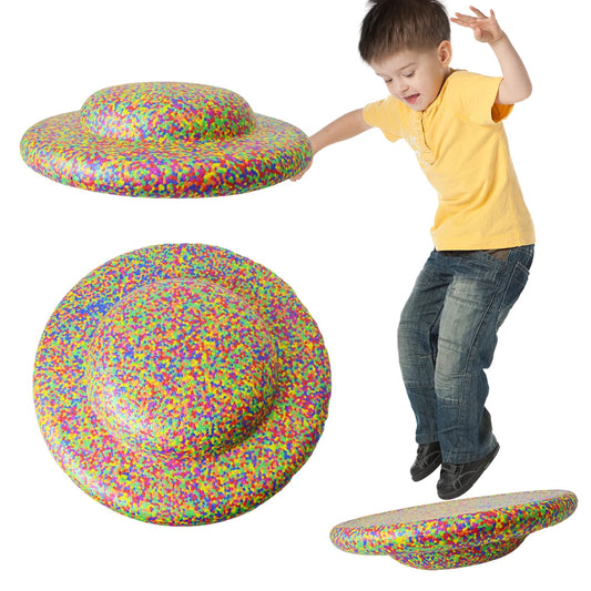 A child in a yellow shirt and jeans jumps on a colorful Stability Board Non-slip Balance Stepping Stones, flower-shaped and multi-functional. Three views—top, side, and perspective—are shown against a white background.