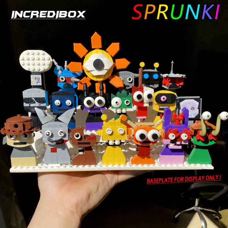 A hand holds the New Moc Incredibox Sprunki Building Blocks Set (772pcs), a vibrant horror anime music game toy with whimsical characters. Text reads INCREDIBOX, SPRUNKI, and BASEPLATE FOR DISPLAY ONLY! in bold colors.