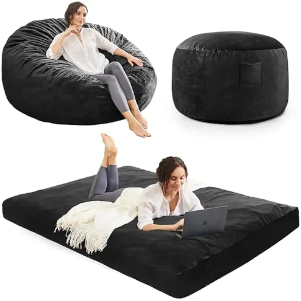 A woman relaxes on a 43-inch Full-Carbon Black Bean Bag Chairs Convertible Bean Bag Bed, sits at a matching ottoman, and lies on the converted bed with a laptop and white blanket.