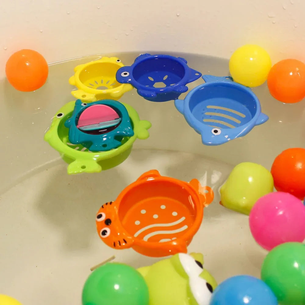 The 6Pcs Baby Bath Toy set includes colorful stacking cups and ocean-themed boats with fun animal designs like green frogs and orange tigers. Vivid yellow, pink, and orange balls enhance this engaging educational toy for water play. Perfect for a vibrant baby bath scene!.
