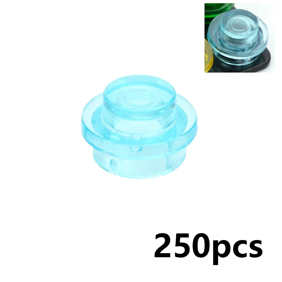 A clear light blue round brick from the MOC Transparent Bulk Brick Set (1x1, 1x2, 1x4, 2x4) compatible with Lego is shown against a white background, with an inset highlighting the set’s variety in this 250-piece collection.