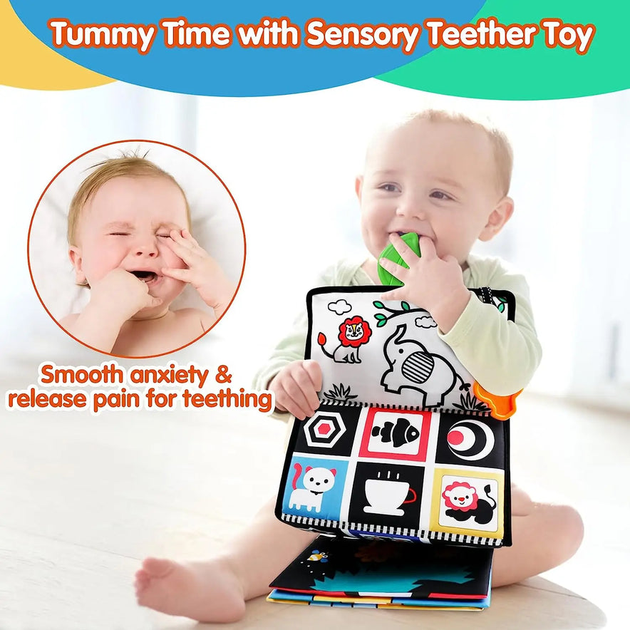 A baby sits on the floor chewing a green teether attached to the Crinkle Cloth Book Visual Stimulation Toy. This sensory toy features animals and patterns alongside an inset of a crying baby with Smooth anxiety & release pain for teething, promoting brain development and visual stimulation.