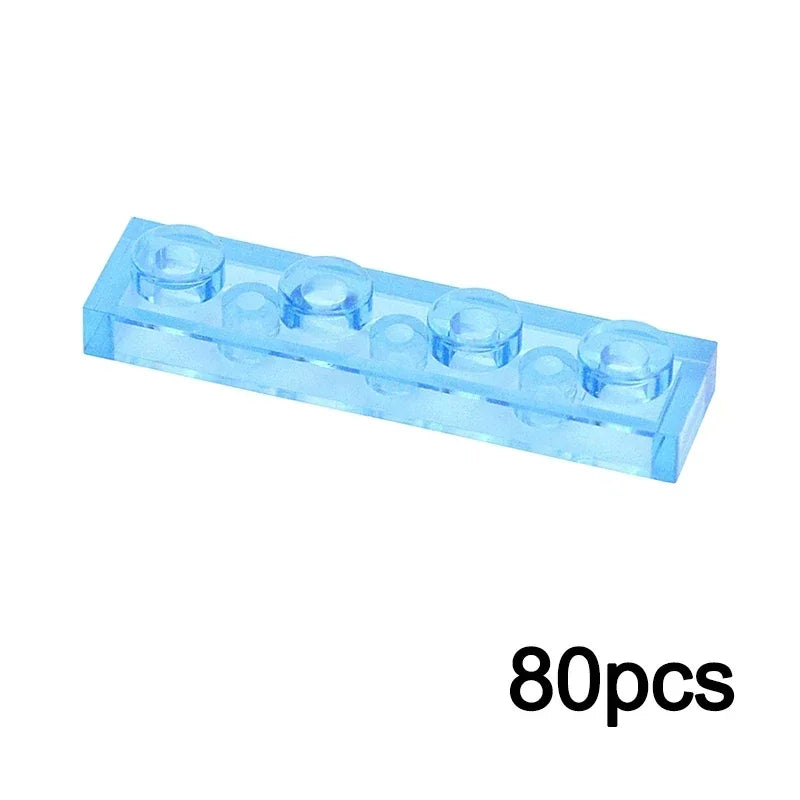 A 1x4 translucent light blue building block, compatible with Lego, from the MOC Transparent Bulk Brick Set—ideal for constructing clear walls and panels.