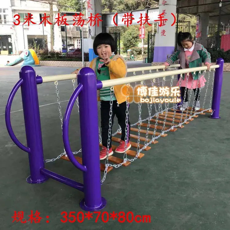 Two children play on a 3-meter wooden plank suspension bridge, part of the outdoor toys collection featuring chains and handrails, akin to unisex toys. They are enjoying the sensory integration and physical training experience in this playground setting.