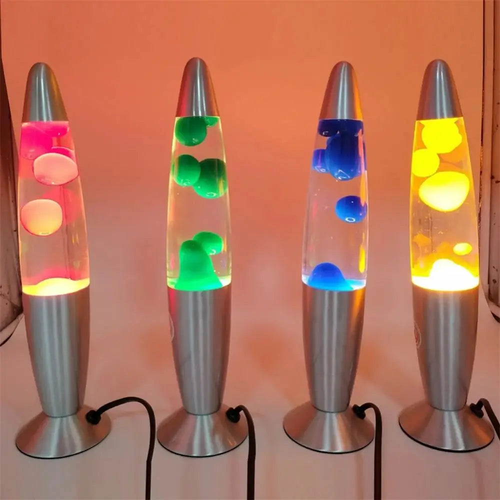 Four Mesmerizing Jellyfish Lava LED Night Lights with aluminum alloy bases glow in vibrant hues of orange, green, blue, and yellow. These decorative lamps line up against a light background, adding a playful touch to any space or kids room at home.