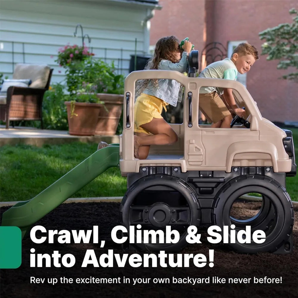 Two kids play in a backyard on the Truck Climber Kids Outdoor Playset with Slide and Wall—one sits on top, the other climbs through the side. Crawl, climb, and slide for outdoor adventure like never before!.