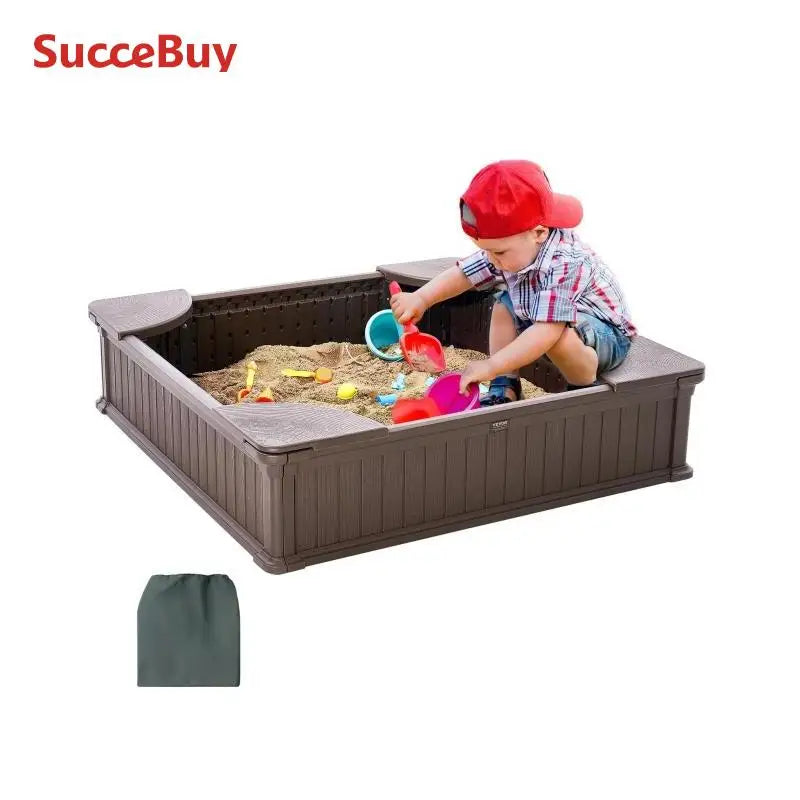 A young child plays in the SucceBuy Sandbox w/ Cover, a square sand pit with 4 corner seats and bottom liner. Colorful toys and a wood assembly set are inside, with a green storage bag nearby. Brand name SucceBuy appears at the top left.