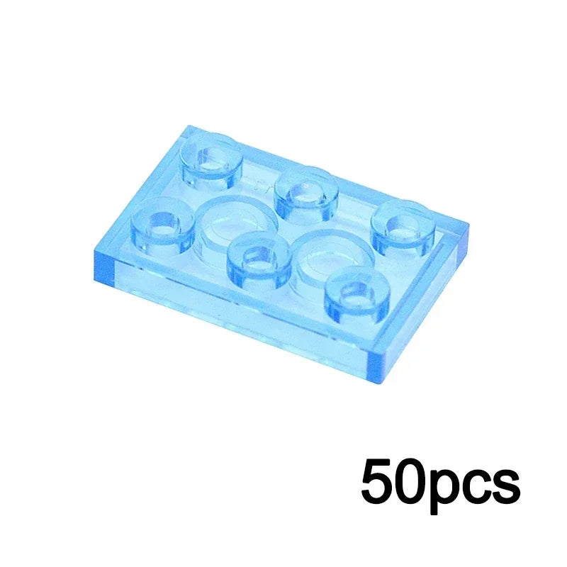 A 2x3 TRN light blue Transparent Bulk Brick, compatible with Lego, from the MOC Transparent Bulk Brick Set is shown above black text reading “50pcs.”.