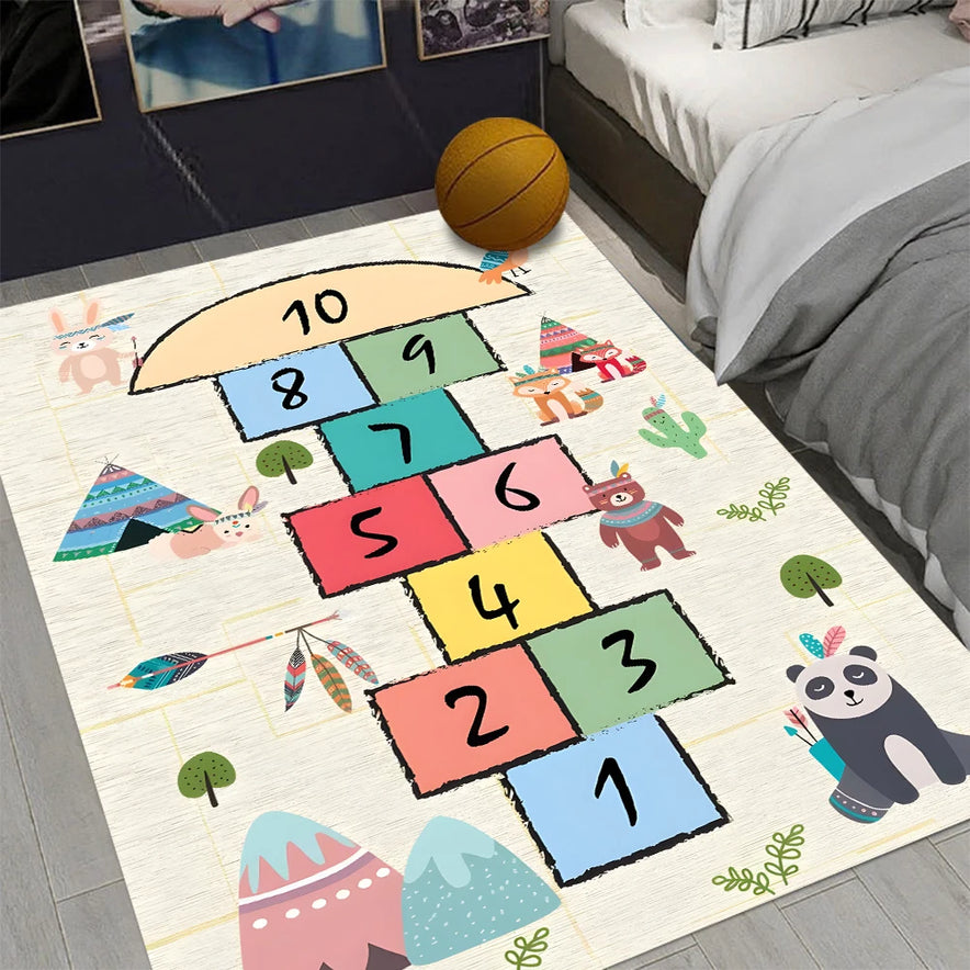 The Hopscotch Printing Carpet in color 2, a non-slip, mechanical washable rug with numbers 1–10 and playful animal prints, is placed beside the bed. A basketball sits on this polyester bedroom mat.