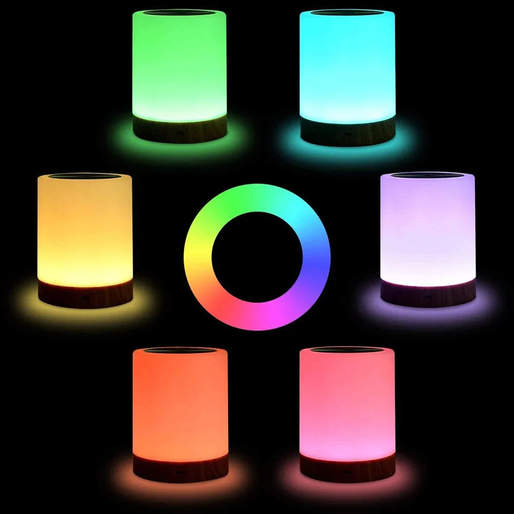 Six cylindrical Portable Touch-Sensitive LED Night Lights offer RGB colors—green, blue, purple, yellow, orange, red—on a black background, with a center color gradient. This rechargeable lamp transforms any room with its vibrant display and makes an ideal gift.