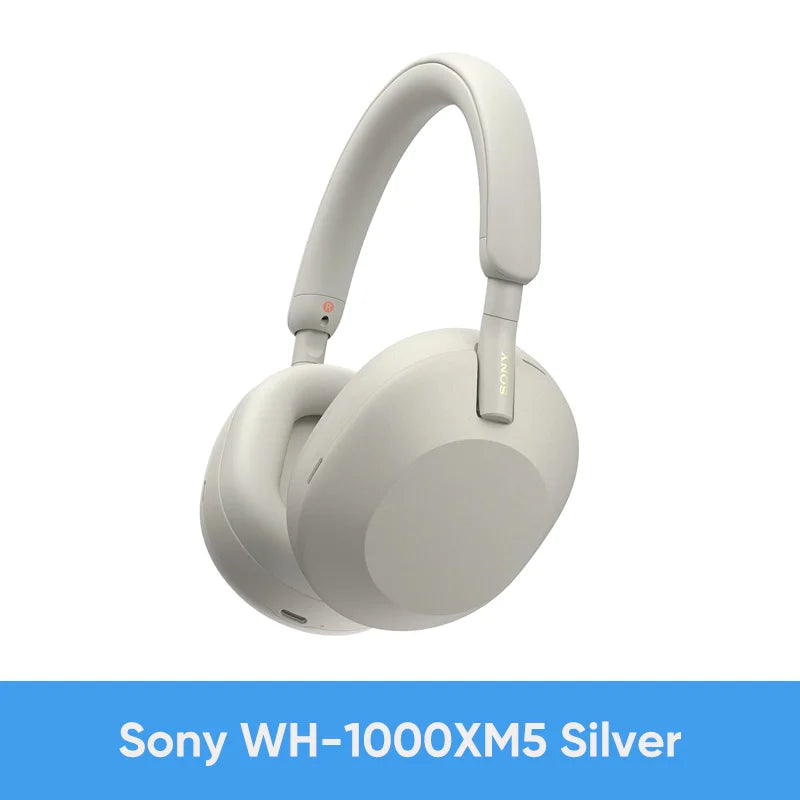 Silver Sony WH-1000XM5 Wireless Noise Canceling Headphones with Integrated Processor V1, Soft Fit Leather, 30-hour battery life, and 4 microphones are displayed above a blue “Sony WH-1000XM5 Silver” label on a white background.