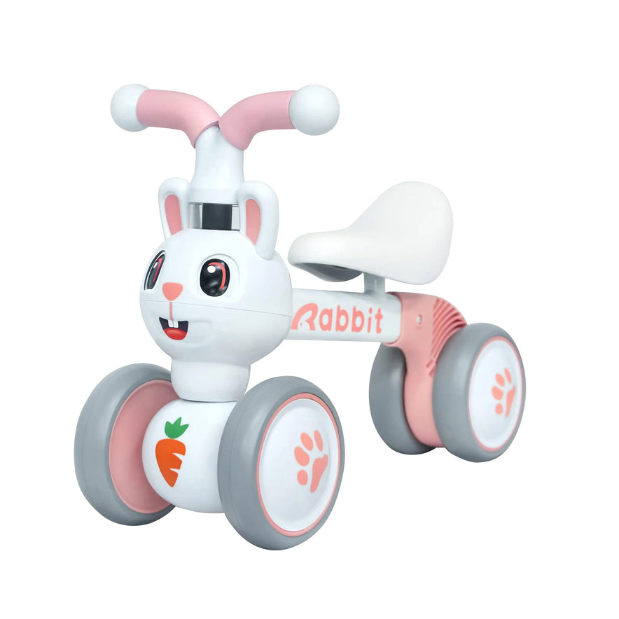 The Baby Balance Bike With 4 Wheels For Toddlers Ages 12 To 36 Months in Pink Rabbit is a cute ride-on toy featuring bunny details, ideal for building motor skills and makes a perfect first birthday gift.