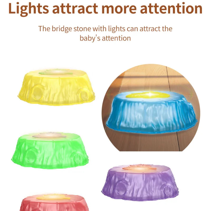 Colorful, cushiony stepping stones in yellow, green, purple, and red with lights surround a glowing blue stone on wooden flooring. The text states: Lights attract more attention. Rainbow Luminous Balance Stones captivate babies for engaging tactile balance training outdoors.