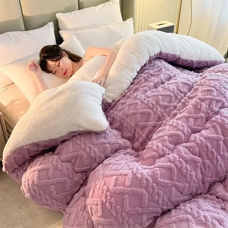 A person is asleep on a bed covered with the Luxurious Artificial Cashmere Weighted Blanket for Ultimate Winter Comfort in lavender. The rooms soft ambient light enhances the cozy bed, positioned against a decorative headboard for an inviting winter warmth.