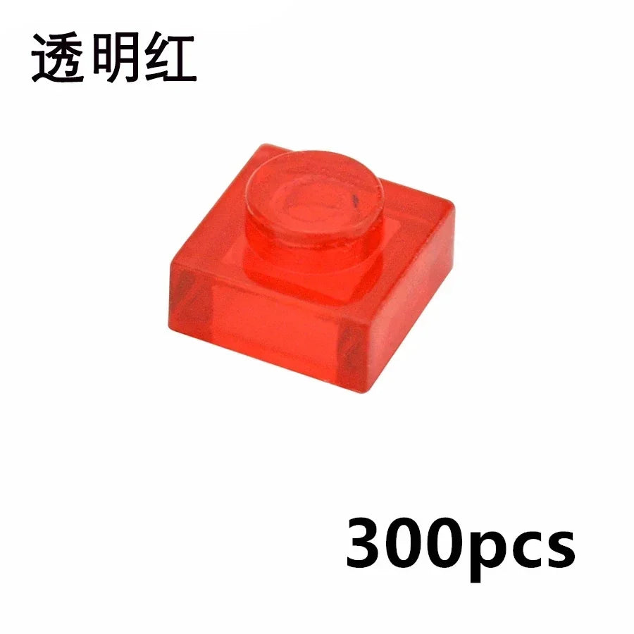 A transparent red MOC Bulk Brick Set includes 1x1, 1x2, 1x4, and 2x4 clear building block parts compatible with Lego—ideal for houses or wall panels. Chinese characters are in the top left and “300pcs” is in the bottom right.
