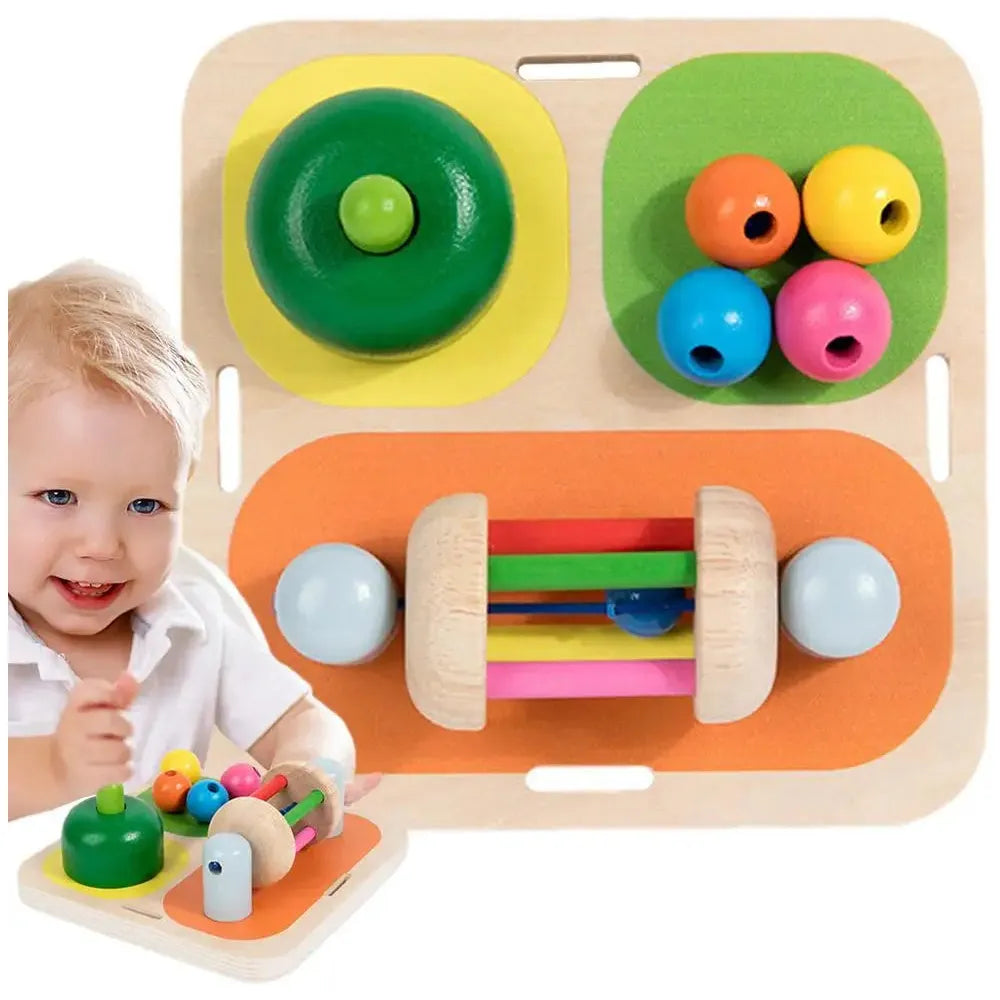 A toddler joyfully engages with the Interactive Wooden Sensory Learning Board for Kids, featuring colorful beads, a green button, and spinning rods. The board promotes fine motor skills through vibrant circular and rectangular shapes in green, yellow, orange, and pink.