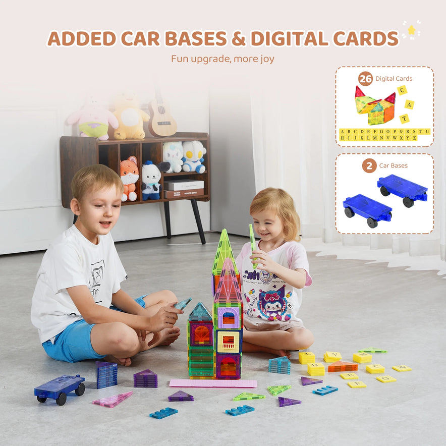 Two children use the VEVOR 121PCS Magnetic Building Blocks Set, featuring magnetic tiles and plastic ferrite pieces. Behind them are stuffed toys. Text highlights Added Car Bases & Digital Cards alongside images showing 26 digital cards and 2 car bases.