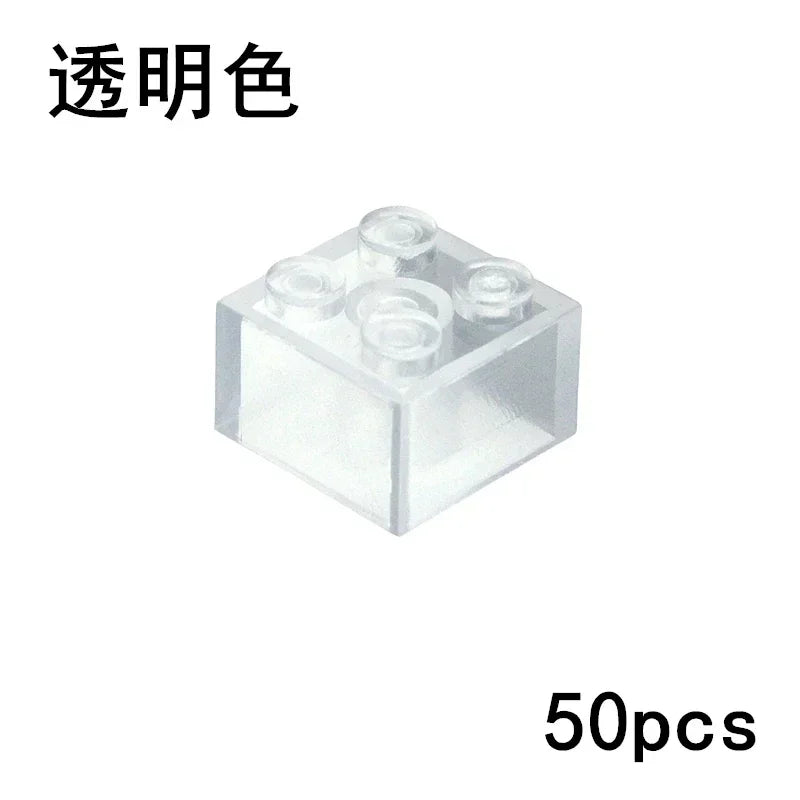 A clear 2x2 Transparent block from the MOC Transparent Bulk Brick Set (1x1, 1x2, 1x4, 2x4) compatible with Lego is shown, with Chinese text at the top left and 50pcs in the bottom right.