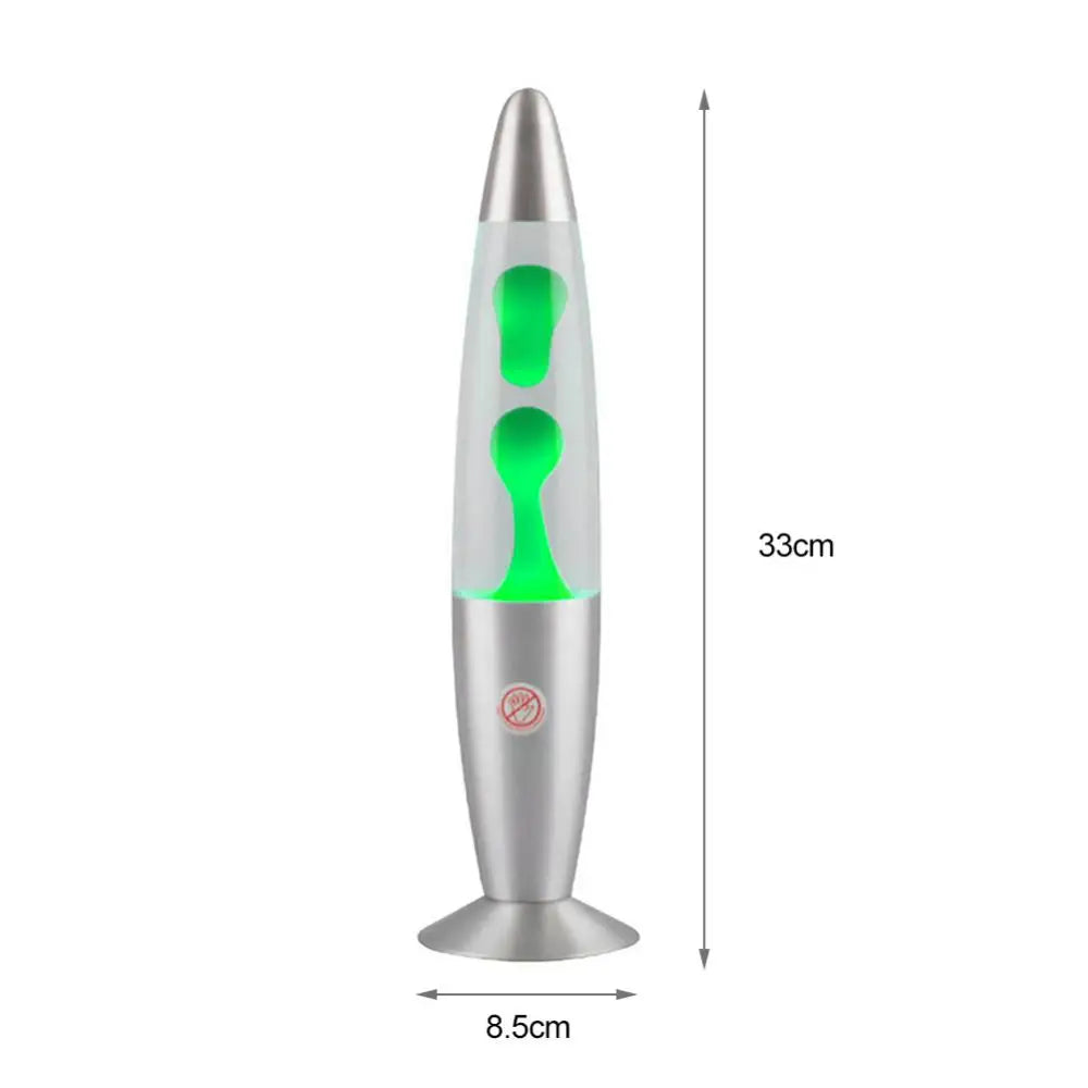 The Mesmerizing Jellyfish Lava LED Night Light, with a silver aluminum base and top, features green wax bubbles resembling jellyfish. Standing at 33cm tall and 8.5cm wide, its perfect for kids rooms and home ambiance.