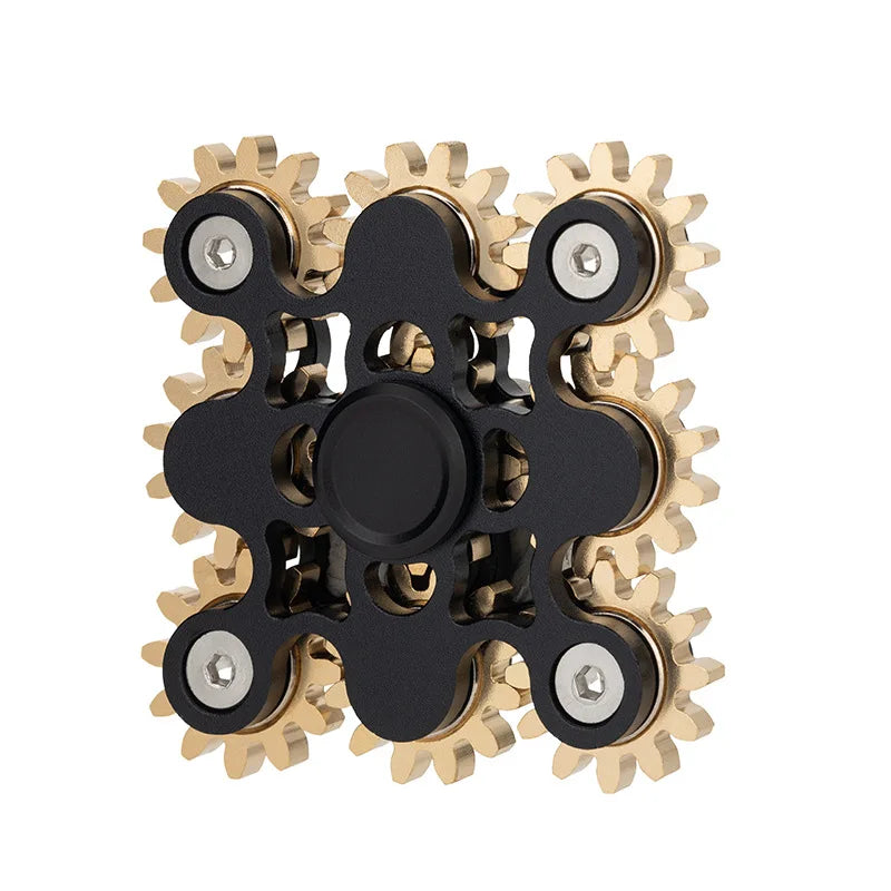 The Bike Chain Metal Fidget Spinner with Magnetic Slider features a square design and a central black hub. It includes four interconnected gear-like discs with gold teeth, offering stress relief through its mechanical appearance.