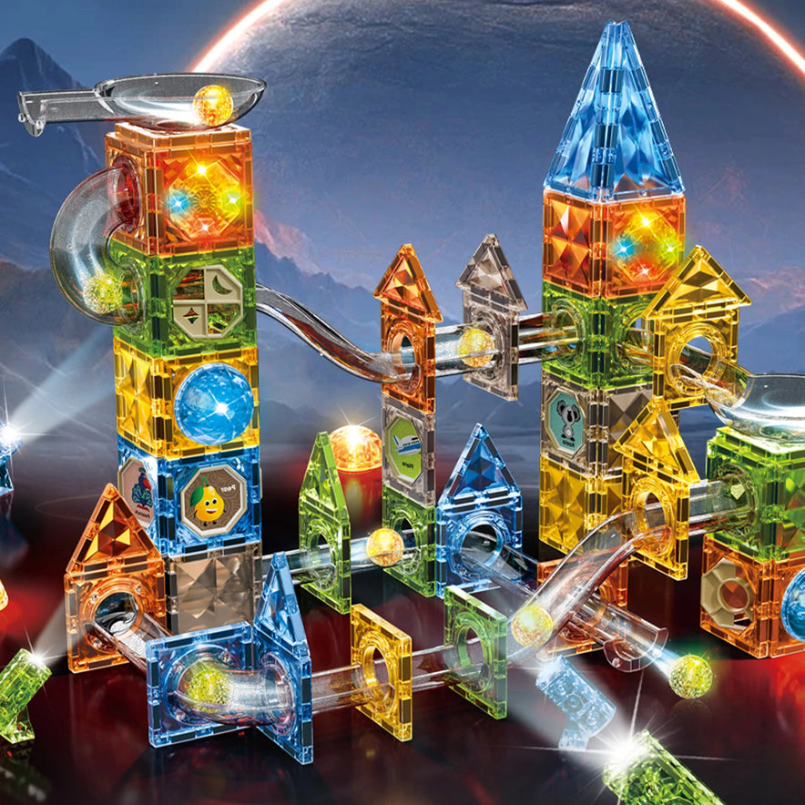 The Magnetic Marble Run Building Blocks Set offers a glowing magnetic marble run with colorful translucent tiles against a cosmic backdrop, featuring geometric shapes like cubes and pyramids. A distant moon sets the scene for STEM-focused learning and creative play.