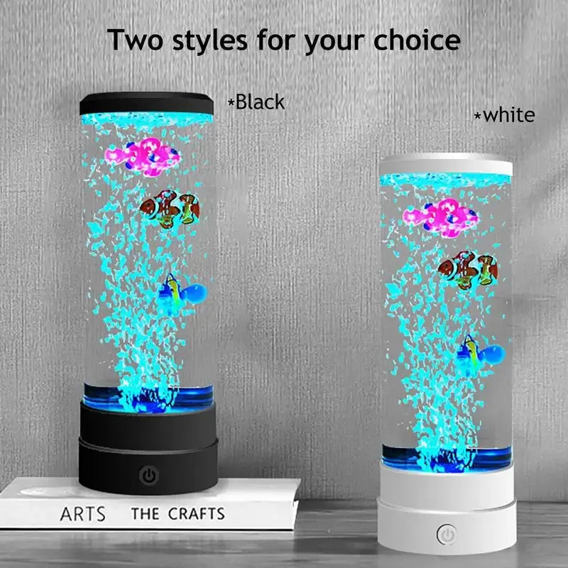 Two Enchanting Bubble Fish Night Light Aquarium Lamps with color-changing effects, one with a black base and the other white, feature colorful floating fish and plants against a textured gray backdrop next to a book labeled ARTS THE CRAFTS, creating a realistic aquarium ambiance in any space.