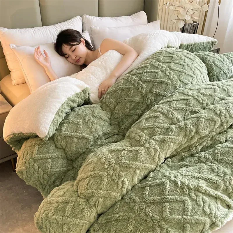 A woman sleeps under the Luxurious Artificial Cashmere Weighted Blanket, enjoying warmth and comfort. The soft, green texture and multiple pillows create a relaxing atmosphere with neutral tones, ideal for a peaceful winter slumber.