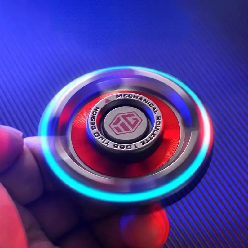 A hand holds the Fidget Spinners for Adults and Kids Stress Relief Anxiety ADHD Toy Metal EDC Hand Spinner with Luminous Light spinning quickly, casting blue and purple light trails against a striped background for stress relief.