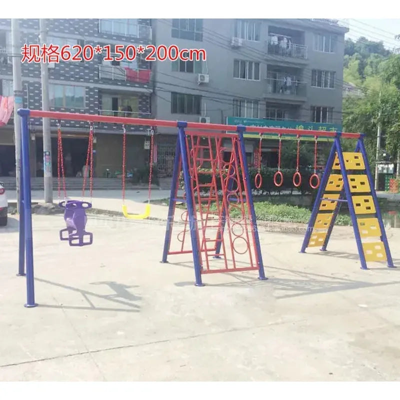 The Outdoor Steel Climbing Frame Swing provides a colorful sensory integration space with swings, rings, a climbing net, and wall on concrete. This diverse play set is surrounded by buildings and greenery.