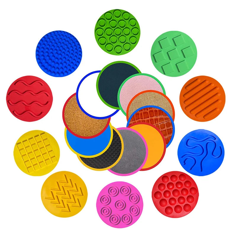 The Montessori Tactile Adventure Mat with Balance Stones offers colorful sensory discs for developmental play, featuring textures and patterns like wavy lines, grids, and dots on a white background.