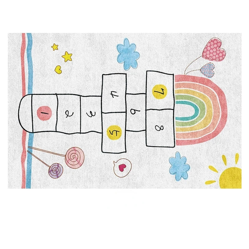 The Childrens Play Hopscotch Carpet is a large, anti-slip polyester rug for living rooms or kids rooms, featuring colorful numbers, rainbows, hearts, stars, lollipops, clouds, and a sun outlined in black on a white background.