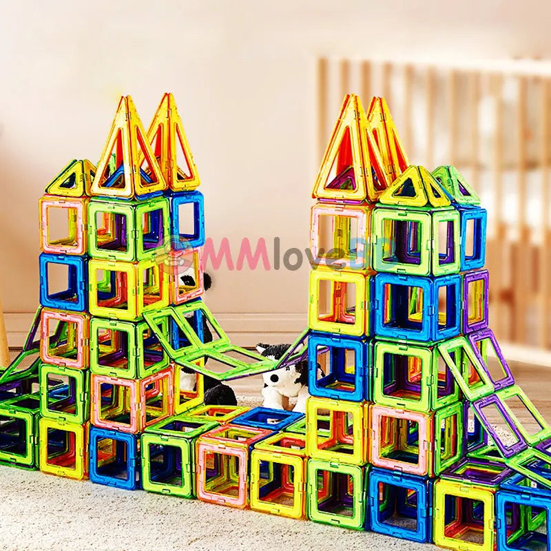 The Giant Magnetic Building Blocks Set for Kids forms a colorful, safe, and durable magnetic castle with vibrant shapes and houses a toy panda. Perfect for STEM learning in wooden rooms, this set is great for creative construction by children ages 4-12.
