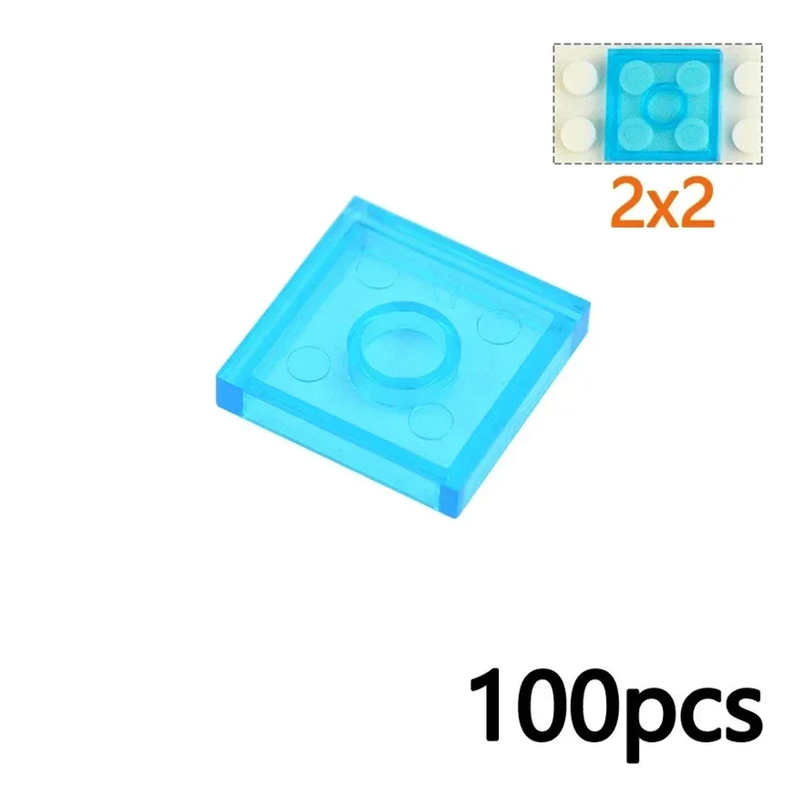 A 3068-ClearLight Blue MOC Transparent Bulk Brick Set tile (compatible with Lego) is shown atop a white base. Inset features the tile in use. 100pcs is at bottom right, and sizes like 2x2 are listed below—ideal for collectors.
