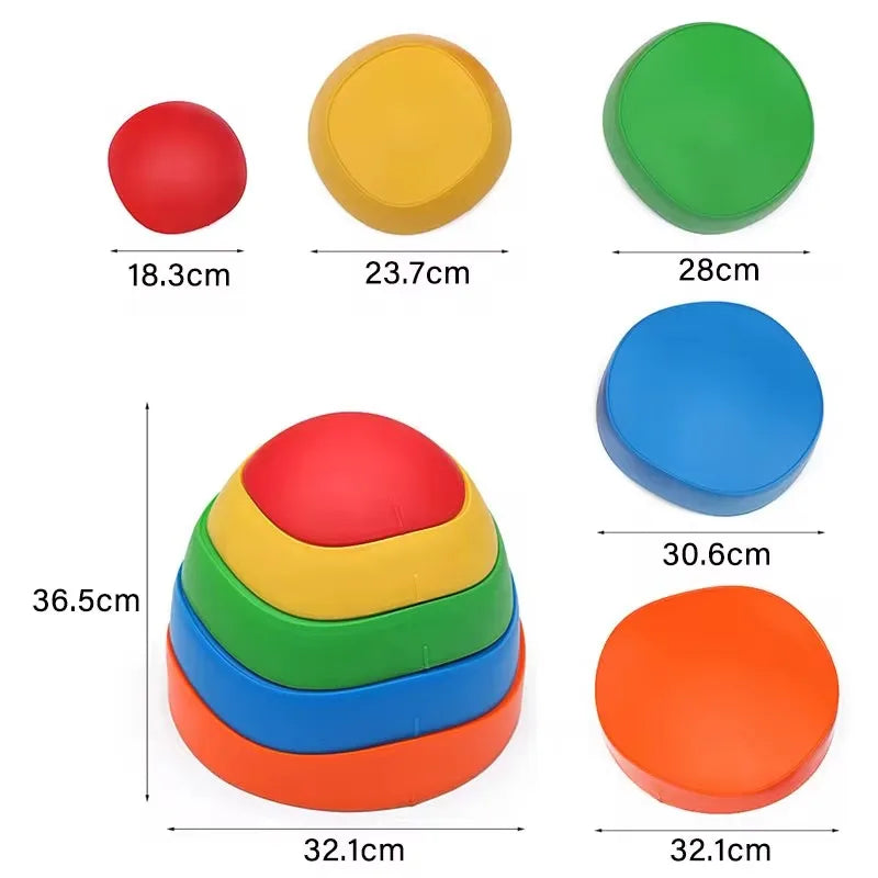 The Adventure Balance Stones: Tactile Sensory Stepping Kit for Outdoor Exploration and Play includes colorful, stackable dome-shaped objects in red, yellow, green, blue, and orange. With diameters ranging from 18.3 cm to 32.1 cm, they can be arranged or stacked to enhance sensory balance and motor skills.