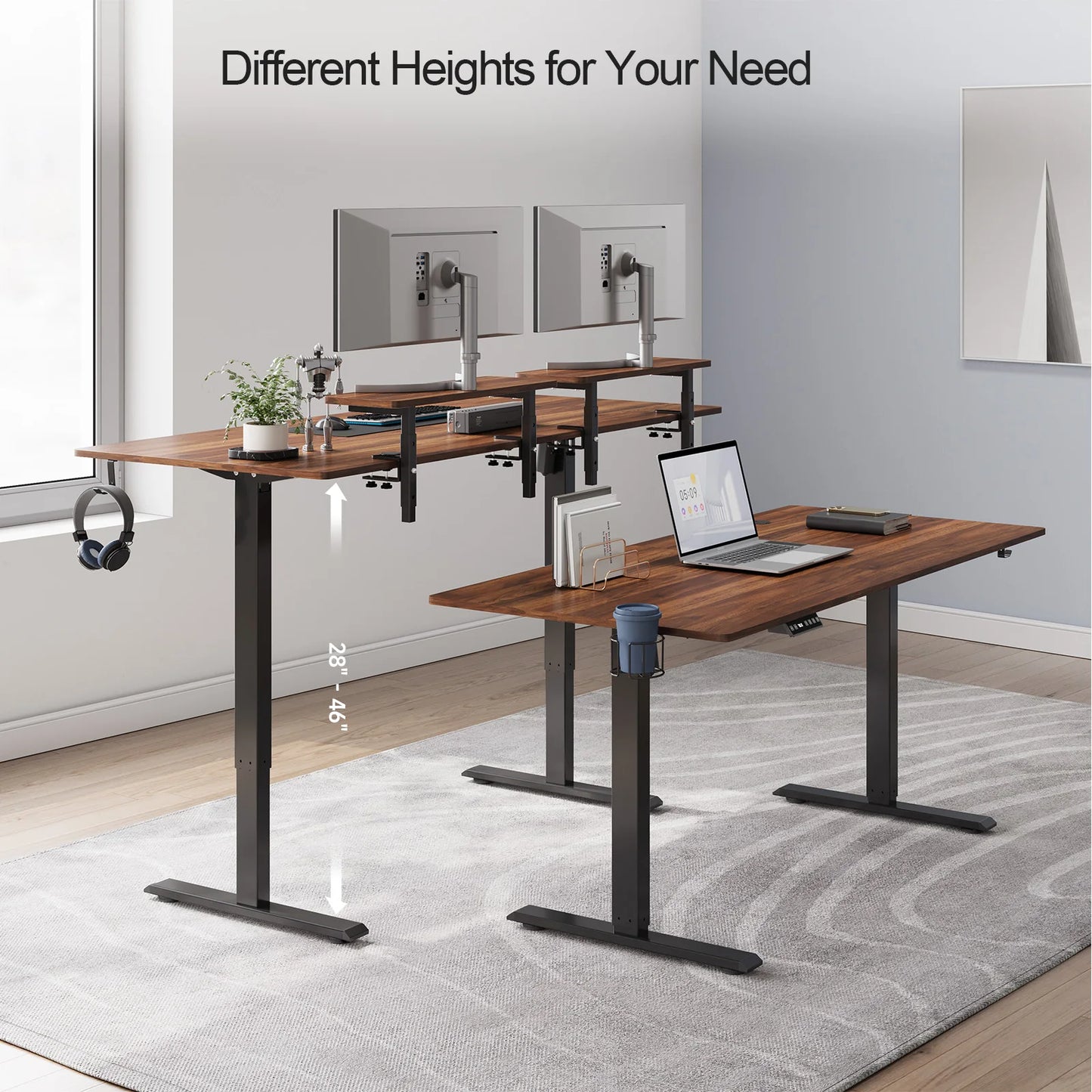 A modern office with two Standing Desks w/ 2 Adjustable Monitor Shelves Electric Stand Up Desk, each supporting monitors, laptops, and accessories. One desk is elevated to highlight its 28–46 height range amid minimalist decor.
